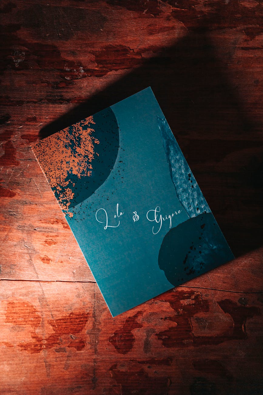 top view of a wedding invitation lying on wooden surface